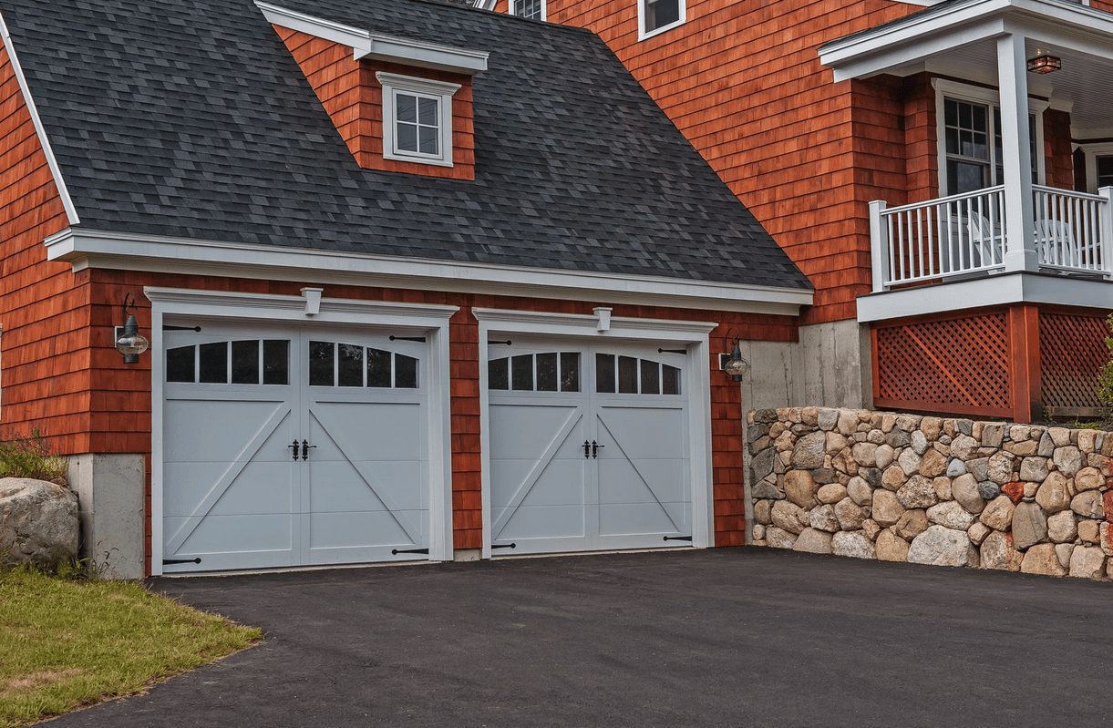 Overlay carriage garage doors white with wood house