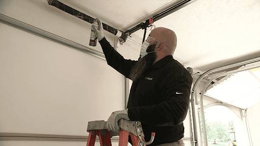 Man repairing garage door